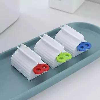Creative Toothpaste Facial Cleanser Hand Cream Squeezer Lazy Manual Japanese Clip Seat Roll Toothpaste Device синий