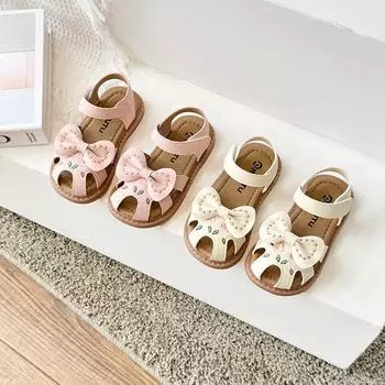 Детские первые ходунки для девочек, сандалии с вышитыми носками, модные детские полые пляжные туфли с бантом, противоскользящие 22 бежевый