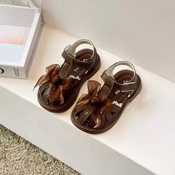 Детские первые ходунки для девочек, сандалии с полыми носами и бантом, модные детские туфли на плоской подошве, принцесса, нескользящие 23 коричневый