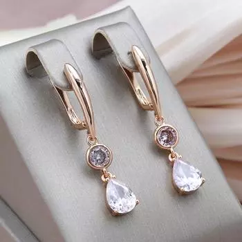 Длинные женские серьги Kinel с белой водой и цирконием розового золота