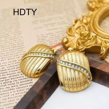 Fashion new niche temperament earrings titanium steel plated 18k gold oval vertical pattern phase zircon earrings золотой