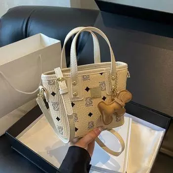 Фирменный дизайн сумка-ведро маленькая для женщин 2024 новая модная сумка для поездок на работу трендовая сумка через плечо с диагональной ручкой розовый