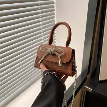 Французская тенденция индивидуальности мини-сумка с текстурой для женщин 2024 года, новая маленькая квадратная сумка с бантом, сумка-мессенджер через плечо в иностранном стиле чёрный