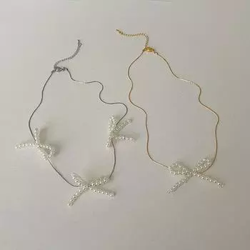 Французское ретро нишевое жемчужное ожерелье-бантик Женский дизайн Чувство индивидуальности Милый универсальный темперамент Цепочка на шею Цепочка на ключицу