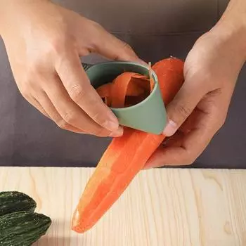 Фруктовая овощечистка Быстрая чистка Простая очистка с трубкой для хранения Нескользящее острое лезвие Очистка пищевых огурцов Морковь Овощечистка для ресторана зелёный