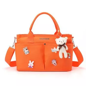 German Mummy Bag Mother and Baby out Mother Carrying Bag out Portable Bag Baby Baby Storage Bag with Baby Handbag Orange [single package + pendant + brooch]]