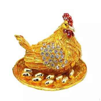Шкатулка для украшений в виде куриного яйца с деталью в виде статуи животного золотой