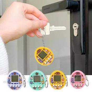 Игрушка для игровой консоли Электронные домашние животные Игровые игрушки с мультяшным принтом Портативные игрушки на батарейках Виртуальные цифровые пиксельные животные Игрушки для детей Детский брелок-игрушка жёлтый