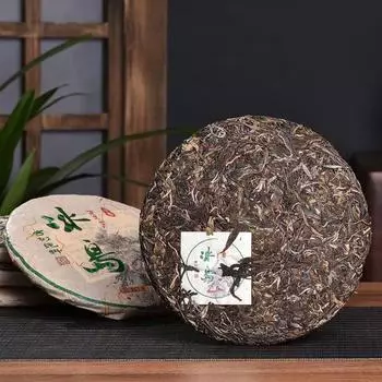 Исландия старое дерево старый бан Чжан чай блин 357 г Юньнань семь блинов чай 18 лет Пуэр чай сырой 357g