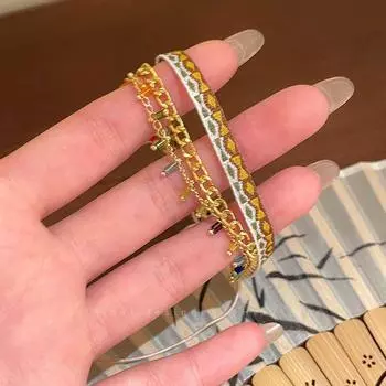 Экзотический этнический стиль плетеный браслет женский богемный многослойный двойной ремешок для переноски легкая роскошь нишевый дизайн ручные украшения Yellow and white multi-layer woven bracelet