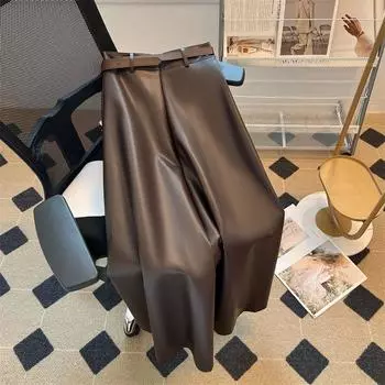Элегантная высококачественная юбка из искусственной кожи для женщин, А-силуэт, утягивающий дизайн, практичные однотонные длинные юбки в корейском стиле, осень-зима S чёрный