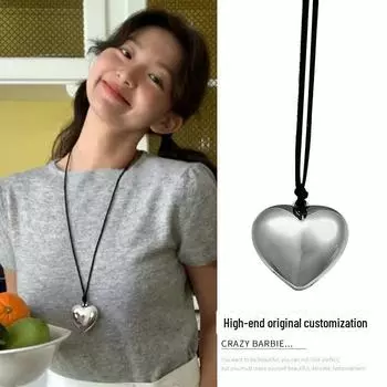 Элегантное черное кожаное ожерелье с подвеской в форме сердца и длинной кисточкой Model X1579 серебряный