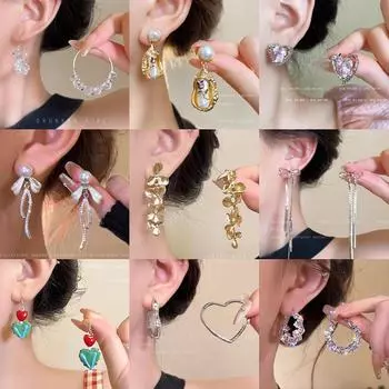 Элегантные серьги-бантики из серебра 925 пробы с жемчугом, кисточками и деталями из циркония