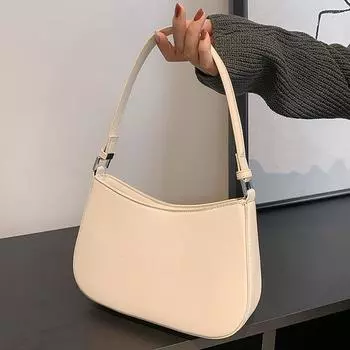 Это небольшая однотонная сумка, простая и модная, подходит для уличных путешествий и шопинга.