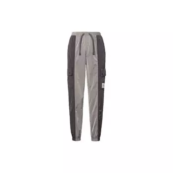 Jordan Женские спортивные брюки Essentials с карманами, тканым логотипом, цветными блоками, завязками на манжетах, в стиле ретро, молниеносно-серые DD6996-286 L