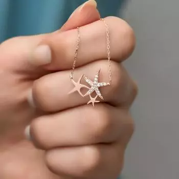 Колье из розового серебра с тремя звездами