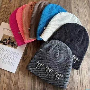 Корейская вязаная шерстяная шапка с бантом для женщин, осень-зима, корейский выпуск, модная теплая и универсальная холодная шапка 55-58cm чёрный