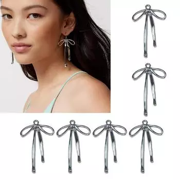 Красивое украшение в виде банта из ленты Элегантное украшение в виде банта из ленты Стильный аксессуар для изготовления ювелирных изделий