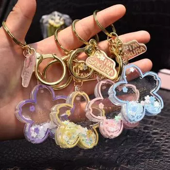 Креативный подарочный брелок и подвеска на сумку в виде акриловой снежинки с жидким наполнением вишневый цвет жёлтый