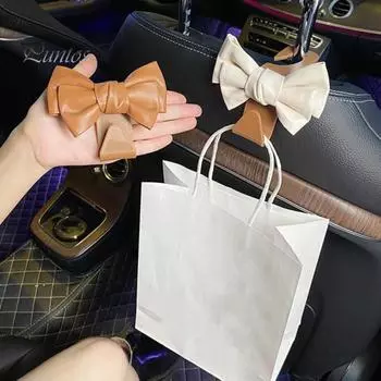 Крючки-бабочки для автомобиля Милый бант-крючок для спинки сиденья автомобиля Вешалка Прочный бант-крючок для кошелька Компактные автомобильные аксессуары светло-коричневого