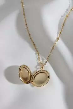 Круглое колье золотого цвета с колпачком из белой эмали, подходящее для двустороннего использования