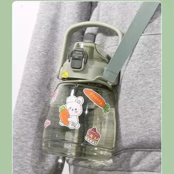 Large capacity cute water bottle with adjustable straw and lid, shoulder strap, anti slip seal, children s water cup gift sticke 1.1L
