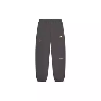 Li Ning Sports Lifestyle Series Модные однотонные свободные спортивные штаны с вышивкой и манжетами, универсальные трикотажные спортивные штаны для мужчин, уличные серые AKLT611-2 S