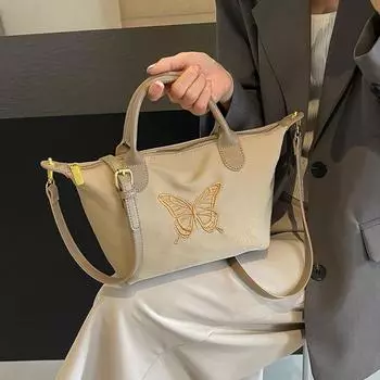 Маленькая сумка для отдыха 2024 года, новая модная тканевая сумка, сумка-пельмень через плечо, женская сумка-бантик для поездок на работу, трендовая сумка Longxiang