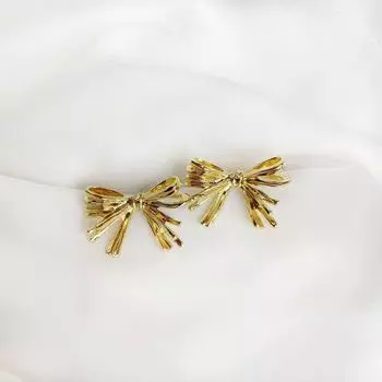 Металлические серьги-банты нишевого дизайна золотистый