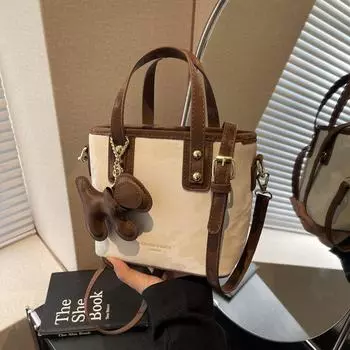 Модная женская сумка-ведро через плечо 2024 года: Нишевый дизайн, универсальная высококачественная сумка через плечо Black without pendant. 19*9*15 чёрный