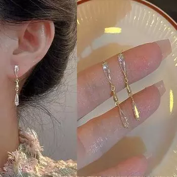 Модные изысканные и сверкающие женские серьги с кисточками и цирконами в виде капель воды