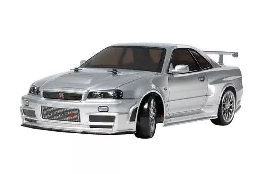 Мужская электрическая радиоуправляемая машинка TAMIYA серии Nismo R34 Drift spec 58605 1/10 No.605 GT-R Z-tune (Шасси ТТ-02Д) на дороге