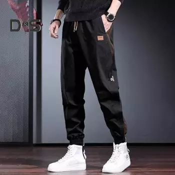 Мужские брюки-карго с карманами на шнурке и эластичной талией с расширяющейся пуговицей на щиколотке. Уличная одежда. Свободные однотонные бегуны. Длинные брюки на открытом воздухе. M хаки