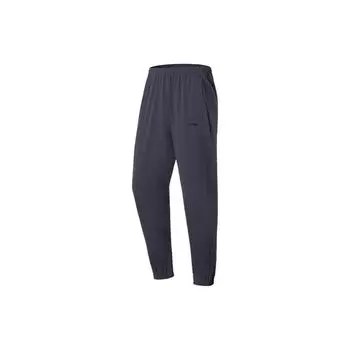 Мужские спортивные брюки Li Ning Fitness Series, однотонные, быстросохнущие, зауженные, холодного, песочно-черного цвета AYKS355-7 M