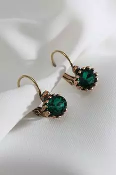 Настоящие серьги с овальными зелеными камнями