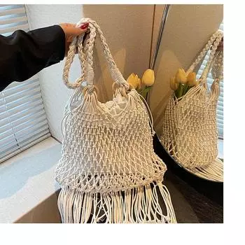 New straw bag handbag diagonal span hollow women s bag beach bag single shoulder fashion hollow fringed armpit bag