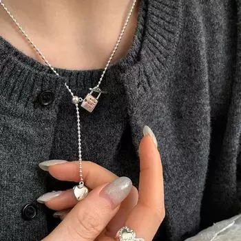 Niche Design Sense Love Lock Выдвижное ожерелье Женская индивидуальность Уникальная Простая мода Универсальная цепочка на шею Цепочка для свитера