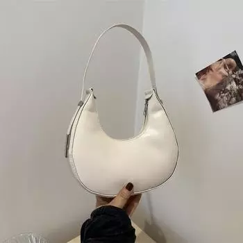Нишевая однотонная дизайнерская сумка для женщин 2024 года, новая модная простая персонализированная сумка-полумесяц, персонализированная переносная сумка через плечо белый