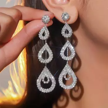 Новые преувеличенные темпераментные длинные серьги-подвески Senior Sense Of Fashion Бриллиантовые полые серьги-сердечки для женщин 1 пара серебряный