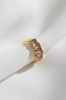 Одинарная серьга из сжатого хряща золотого цвета с камнем-багетом