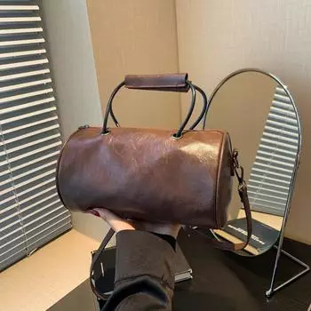 Однотонная женская сумка 2024 года, новая модная нишевая дизайнерская портативная сумка через подмышку, простая цилиндрическая женская сумка через плечо чёрный