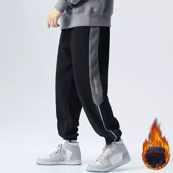 Осенние и зимние модные мужские теплые повседневные брюки, черные полосатые свободные модные брюки, универсальные крутые модные брюки-шаровары, спортивные брюки с ремешками на щиколотке 2XL чёрный