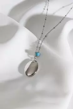 Овальное колье серебряного цвета с оранжевой эмалированной крышкой, подходит для двустороннего использования