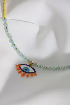 Ожерелье из желтых бусин с разноцветными эмалированными подвесками в виде глаз