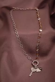 Ожерелье серебряного цвета с хрустальным камнем медового цвета