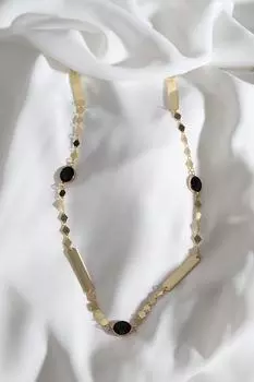Ожерелье золотого цвета с черным камнем и полосками