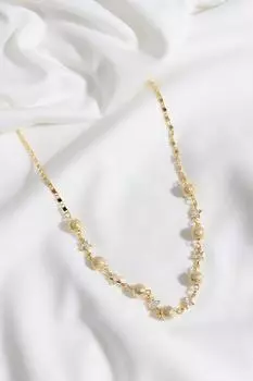 Ожерелье золотого цвета с деталями в виде звездного камня и шара