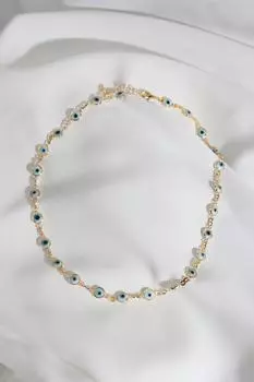 Ожерелье золотого цвета с рисунком глаза