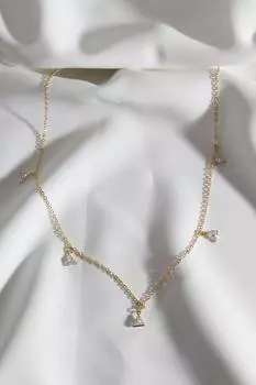 Ожерелье золотого цвета с рядами треугольных камней