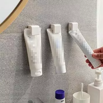 Подставка для зубной пасты Настенный держатель для зубной пасты без перфоратора, артефакт для выдавливания зубной пасты, зажим для очищающего средства для лица, настенное хранение в ванной и туалете 1pc белый